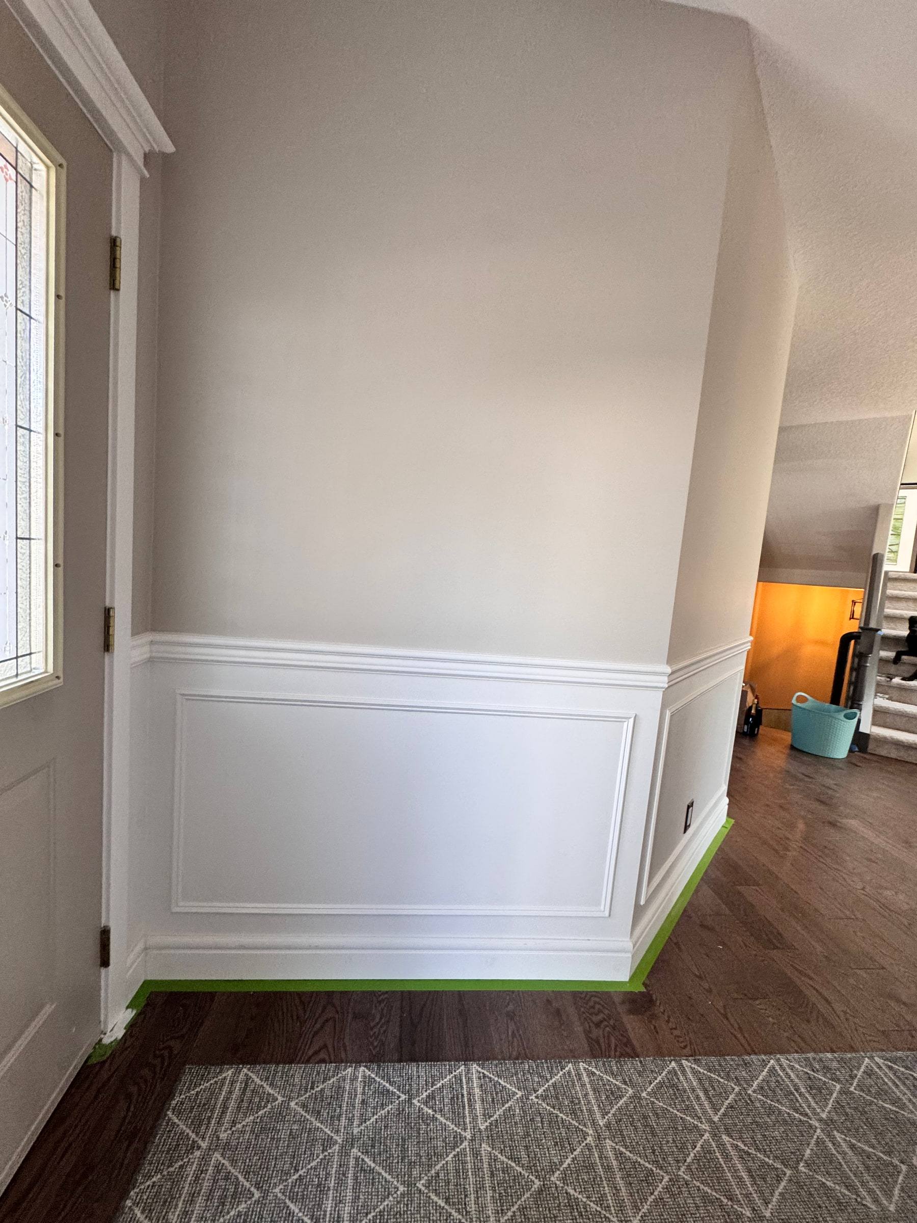 Wainscoting panel along an entry wall beside the front door, just installed